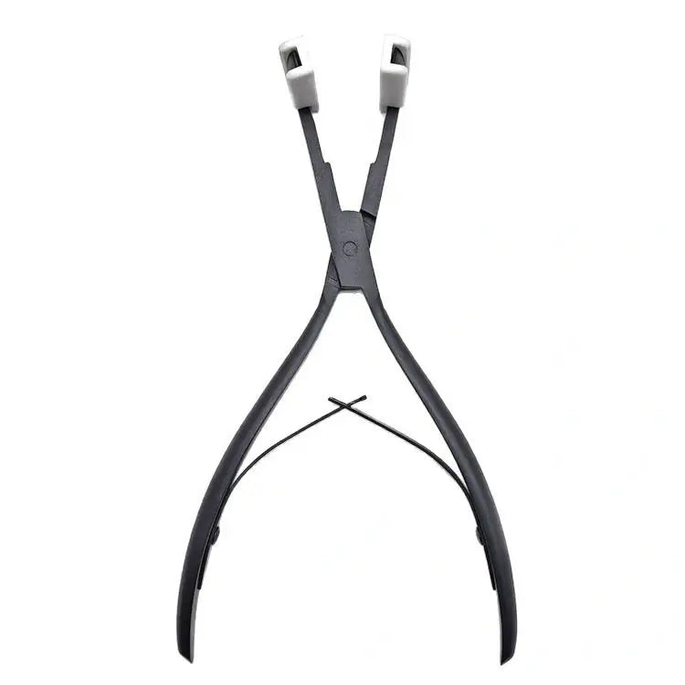 Close-up of professional stainless steel Tape-In pliers